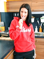 Brunette cutie stroking her vagina with a piece of candy