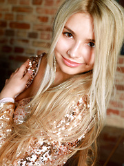 Alluring blonde Candice Lauren shows off her big tits and smooth pussy on the piano.